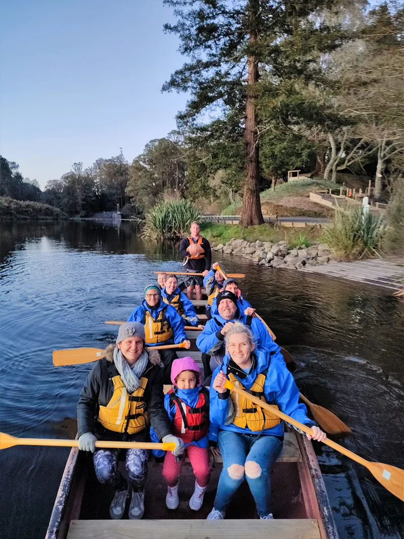 Families paddling the Big Kanu on Lake McLaren