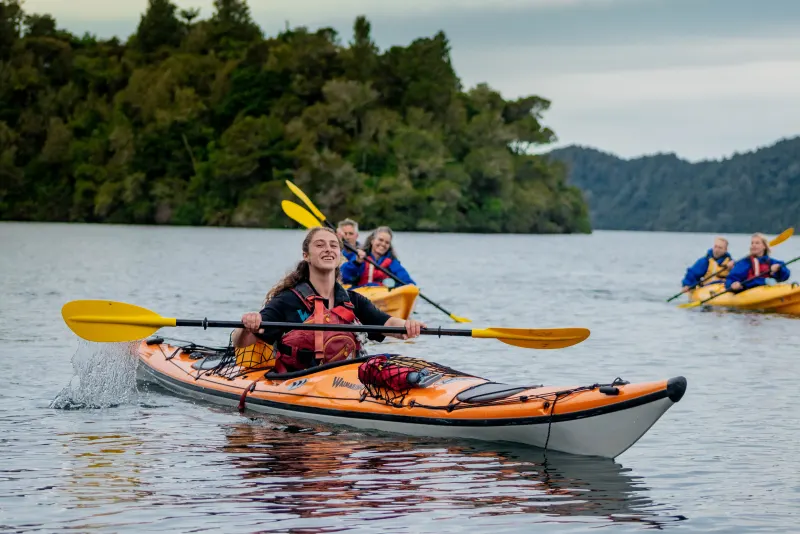 Paddling out across Lake Rotoiti on the Starlight Gourmet Kayak Tour
