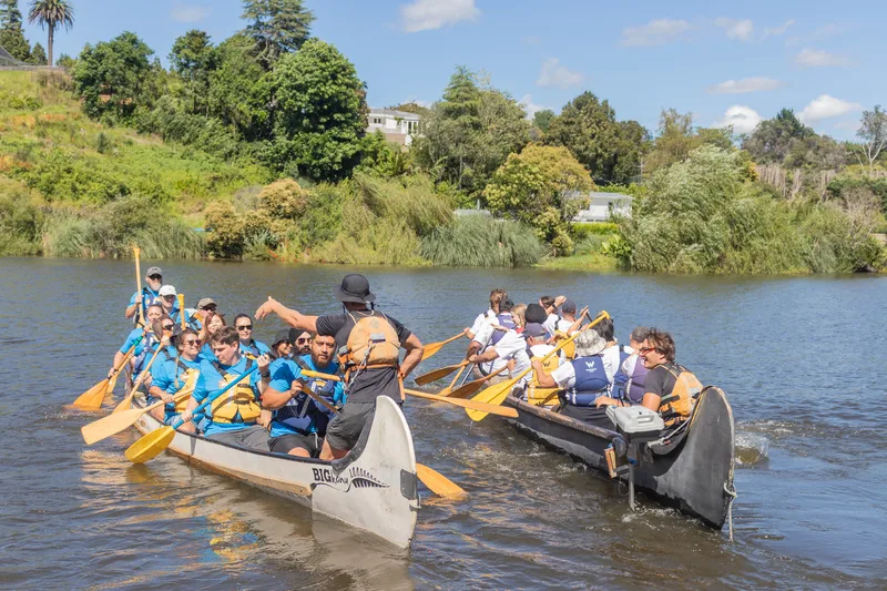 Two teams racing across the lake